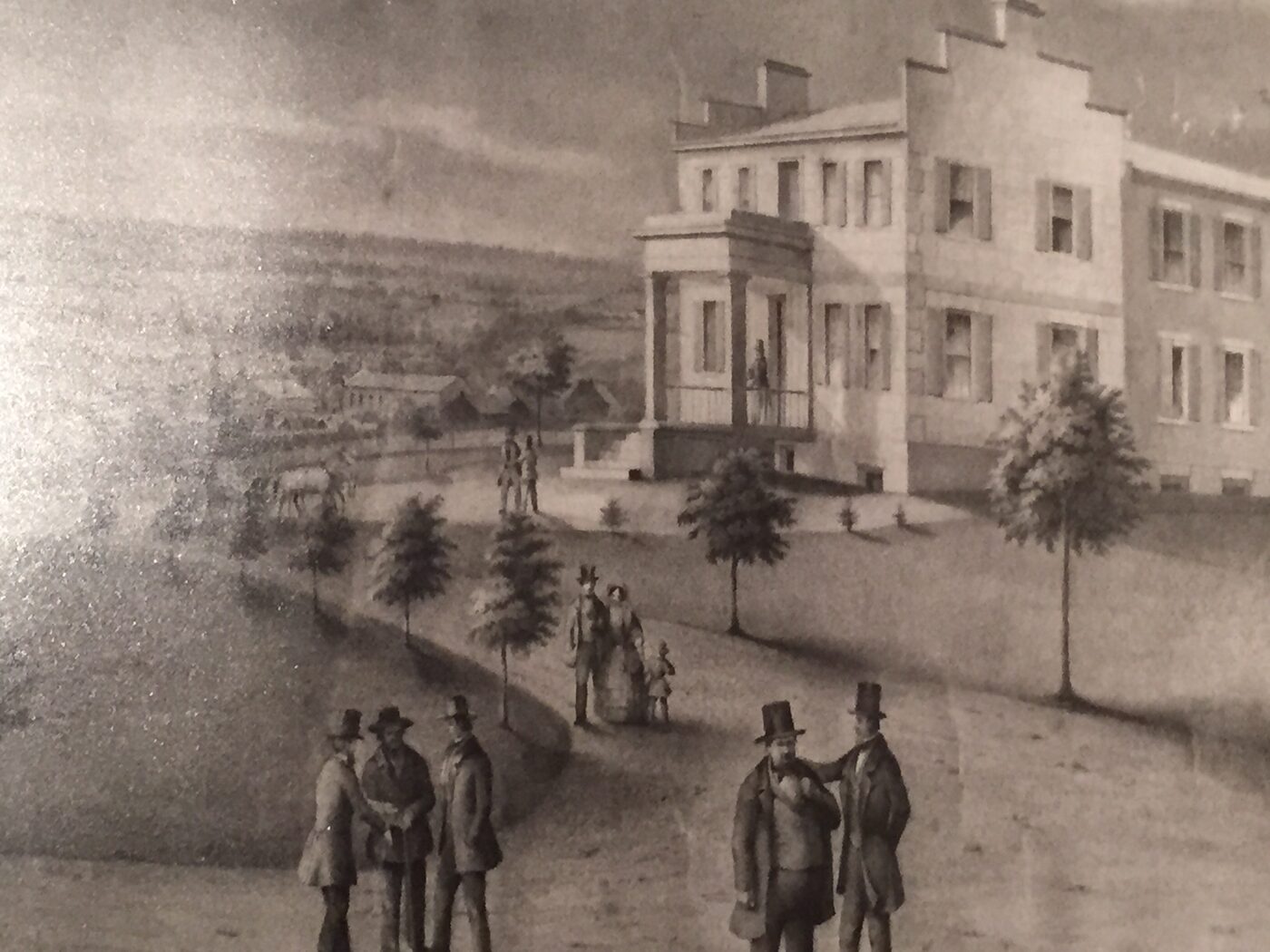 A period engraving of the Academy with figures in top hats walking before it.